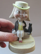 Load image into Gallery viewer, Antique Porcelain Nodder or Swinger Pin Tray by Schafer &amp; Vater. Boy Wearing Yellow Straw Hat with Black Cat
