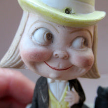 Load image into Gallery viewer, Antique Porcelain Nodder or Swinger Pin Tray by Schafer &amp; Vater. Boy Wearing Yellow Straw Hat with Black Cat
