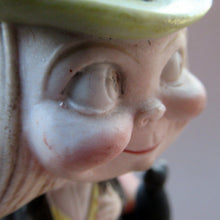 Load image into Gallery viewer, Antique Porcelain Nodder or Swinger Pin Tray by Schafer &amp; Vater. Boy Wearing Yellow Straw Hat with Black Cat
