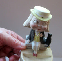 Load image into Gallery viewer, Antique Porcelain Nodder or Swinger Pin Tray by Schafer &amp; Vater. Boy Wearing Yellow Straw Hat with Black Cat
