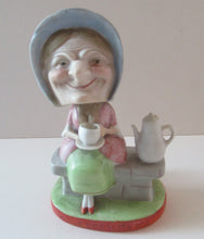 Load image into Gallery viewer, Antique Porcelain Nodder Figurine by Schafer &amp; Vater. Old Lady in Garden Drinking Tea 
