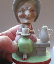 Load image into Gallery viewer, Antique Porcelain Nodder Figurine by Schafer &amp; Vater. Old Lady in Garden Drinking Tea 
