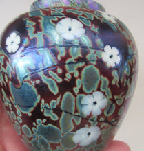 Load image into Gallery viewer, Vintage Okra Glass Ginger Jar Iridescent Finish and White Flowers. Signed
