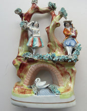 Load image into Gallery viewer, Antique Miniature Staffordshire Figure. Couple Making Music. Swan in River
