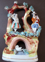 Load image into Gallery viewer, Antique Miniature Staffordshire Figure. Couple Making Music. Swan in River

