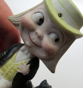 Antique Porcelain Nodder or Swinger Pin Tray by Schafer & Vater. Boy Wearing Yellow Straw Hat with Black Cat