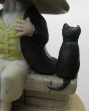 Load image into Gallery viewer, Antique Porcelain Nodder or Swinger Pin Tray by Schafer &amp; Vater. Boy Wearing Yellow Straw Hat with Black Cat
