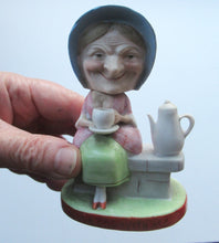 Load image into Gallery viewer, Antique Porcelain Nodder Figurine by Schafer &amp; Vater. Old Lady in Garden Drinking Tea 
