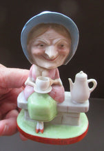 Load image into Gallery viewer, Antique Porcelain Nodder Figurine by Schafer &amp; Vater. Old Lady in Garden Drinking Tea 
