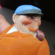 Load image into Gallery viewer, Porcelain Figure by Schafer &amp; Vater. Match Holder in the Form of a Man in an Orange Jacket: ON STRIKE
