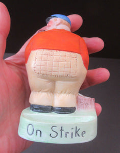 Porcelain Figure by Schafer & Vater. Match Holder in the Form of a Man in an Orange Jacket: ON STRIKE