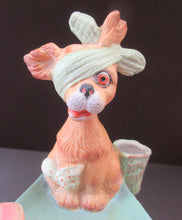 Load image into Gallery viewer, Bisque Porcelain Figure by Schafer &amp; Vater. Comical Dog Model Set Onto an Ashtray
