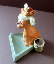 Load image into Gallery viewer, Bisque Porcelain Figure by Schafer &amp; Vater. Comical Dog Model Set Onto an Ashtray
