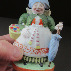 Bisque Porcelain Figure by Schafer & Vater. Match Holder in the Form of a Lady Carrying a Basket 