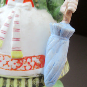 Bisque Porcelain Figure by Schafer & Vater. Match Holder in the Form of a Lady Carrying a Basket 