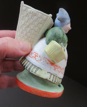 Load image into Gallery viewer, Bisque Porcelain Figure by Schafer &amp; Vater. Match Holder in the Form of a Lady Carrying a Basket 
