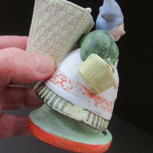 Bisque Porcelain Figure by Schafer & Vater. Match Holder in the Form of a Lady Carrying a Basket 