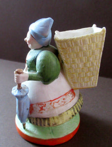 Bisque Porcelain Figure by Schafer & Vater. Match Holder in the Form of a Lady Carrying a Basket 
