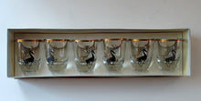 Load image into Gallery viewer, Black Reindeers. Vintage 1960s Set of Six Wee Shot Glasses with Stylised Black and Gold Reindeer Design
