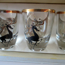 Load image into Gallery viewer, Black Reindeers. Vintage 1960s Set of Six Wee Shot Glasses with Stylised Black and Gold Reindeer Design
