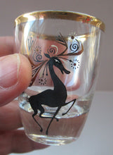 Load image into Gallery viewer, Black Reindeers. Vintage 1960s Set of Six Wee Shot Glasses with Stylised Black and Gold Reindeer Design
