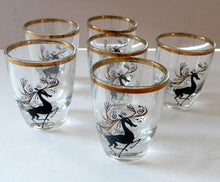 Load image into Gallery viewer, Black Reindeers. Vintage 1960s Set of Six Wee Shot Glasses with Stylised Black and Gold Reindeer Design
