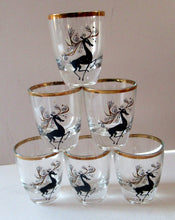 Load image into Gallery viewer, Black Reindeers. Vintage 1960s Set of Six Wee Shot Glasses with Stylised Black and Gold Reindeer Design
