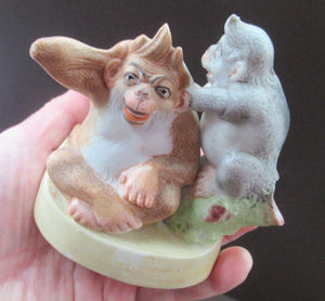 Porcelain Figurine by Schafer & Vater. Quirky GROOMING MONKEYS Match Holder & Striker