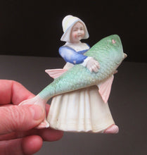 Load image into Gallery viewer, Schafer &amp; Vater Figurine. Dutch Girl Carrying a Massive Fish
