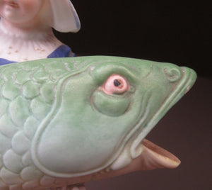 Schafer & Vater Figurine. Dutch Girl Carrying a Massive Fish