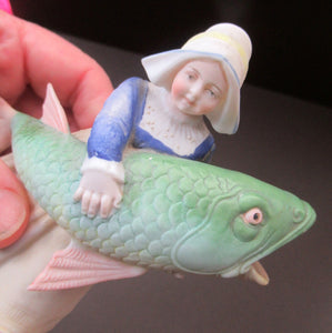 Schafer & Vater Figurine. Dutch Girl Carrying a Massive Fish