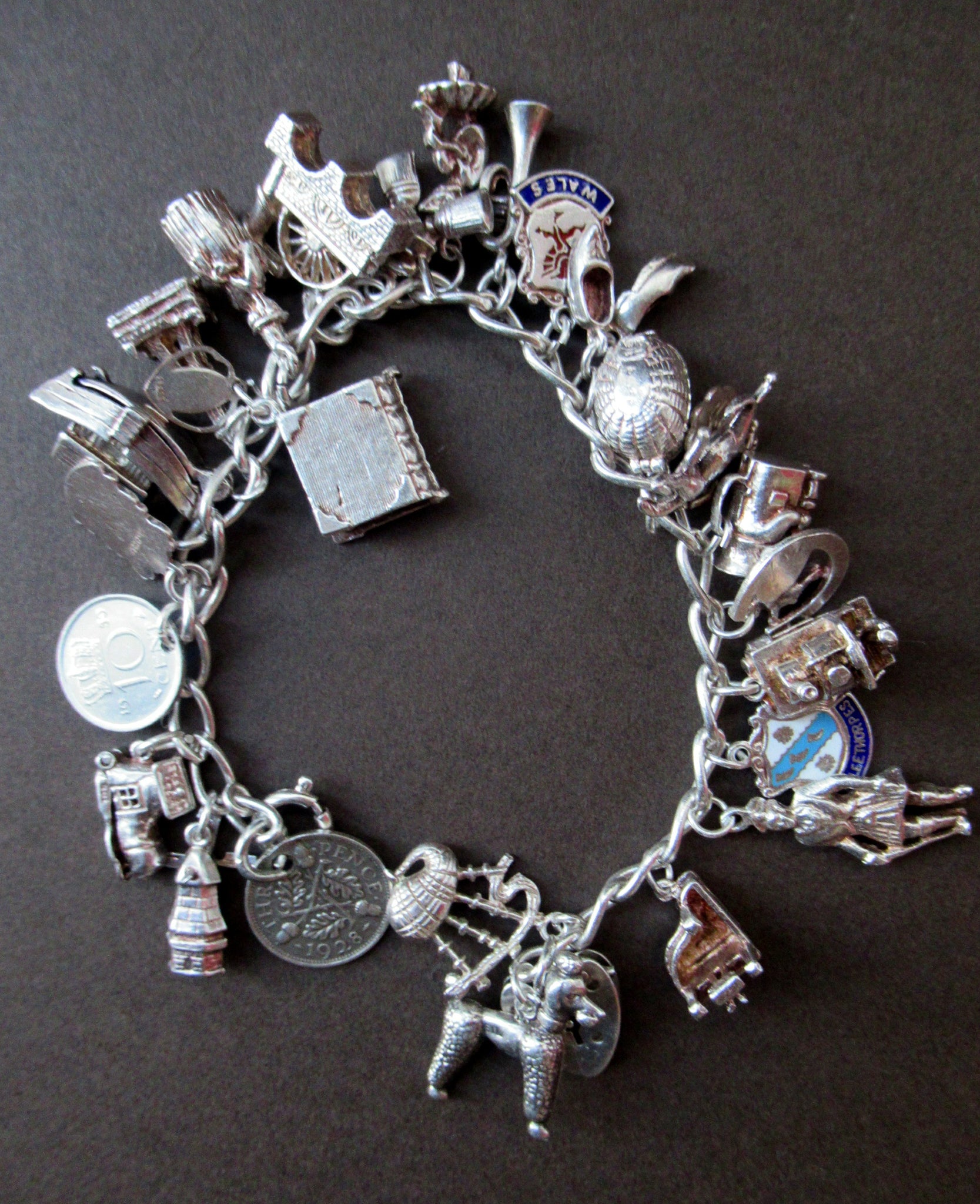 1950s Sterling Silver English Padlocked Charm Bracelet with Seventeen Charms  For Sale at 1stDibs | 1950s charm bracelet, vintage silver charm bracelet  1950s, vintage silver charm bracelet, 1950s