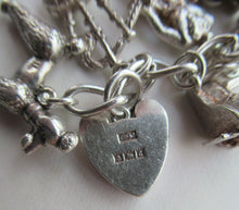 Load image into Gallery viewer, Vintage 1950s Sterling Silver Charm Bracelet
