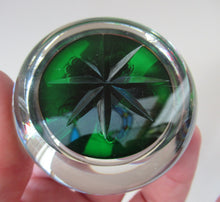 Load image into Gallery viewer, 1970s Perthshire Paperweight with Star-Shaped Clusters on Transluscent Emerald Green Base
