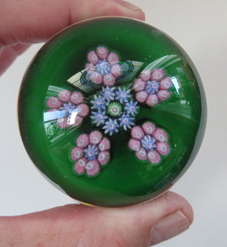 1970s Perthshire Paperweight with Star-Shaped Clusters on Transluscent Emerald Green Base
