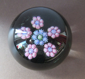 1970s Perthshire Paperweight with Star-Shaped Clusters on Transluscent Emerald Green Base