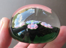 Load image into Gallery viewer, 1970s Perthshire Paperweight with Star-Shaped Clusters on Transluscent Emerald Green Base
