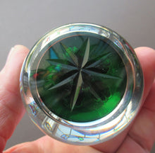 Load image into Gallery viewer, 1970s Perthshire Paperweight with Star-Shaped Clusters on Transluscent Emerald Green Base
