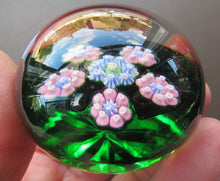 Load image into Gallery viewer, 1970s Perthshire Paperweight with Star-Shaped Clusters on Transluscent Emerald Green Base
