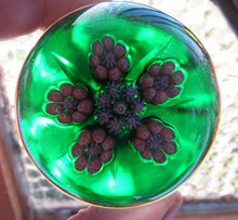 Load image into Gallery viewer, 1970s Perthshire Paperweight with Star-Shaped Clusters on Transluscent Emerald Green Base
