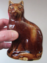 Load image into Gallery viewer, Antique Pottery Money Bank Box in the Shape of a Cat. Treacle Glaze
