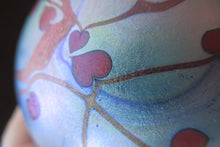 Load image into Gallery viewer, Attractive 1980s Hearts and Vines Pattern Paperweight with Iridescent Finish

