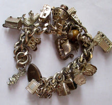 Load image into Gallery viewer, Heavy Weight. Vintage Silver Bracelet with 19 Quality Charms. Hallmarked Padlock Catch

