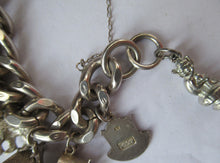 Load image into Gallery viewer, Heavy Weight. Vintage Silver Bracelet with 19 Quality Charms. Hallmarked Padlock Catch
