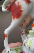 Load image into Gallery viewer, Unusual Antique Staffordshire Cow and Milkmaid Spill Vase and Milk Jug
