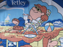Load image into Gallery viewer, VINTAGE 1990s Cotton Tea Towel or Bar Cloth. Circular TETLEYS TEA Advertising Cloth
