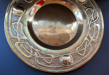 Load image into Gallery viewer, Glasgow School Celtic Design Brass Wall Charger with Knotwork Pattern c 1900
