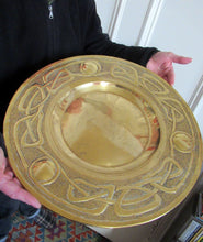 Load image into Gallery viewer, Glasgow School Celtic Design Brass Wall Charger with Knotwork Pattern c 1900

