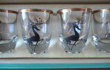 Load image into Gallery viewer, Vintage 1960s Shot Glasses with Black and Gold Reindeer Images
