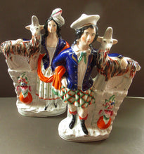 Load image into Gallery viewer, Large Matching Pair Staffordshire Figurines. Man and Woman at a Well with Goats. Antique 1860s
